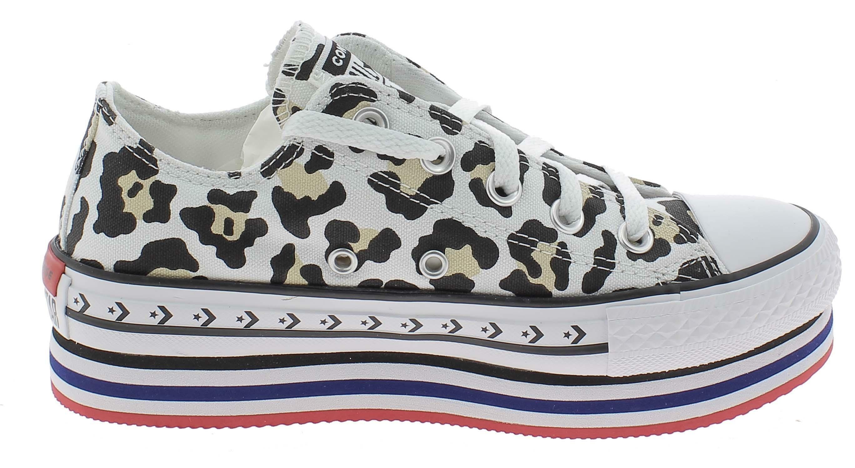 scarpe sportive maculate