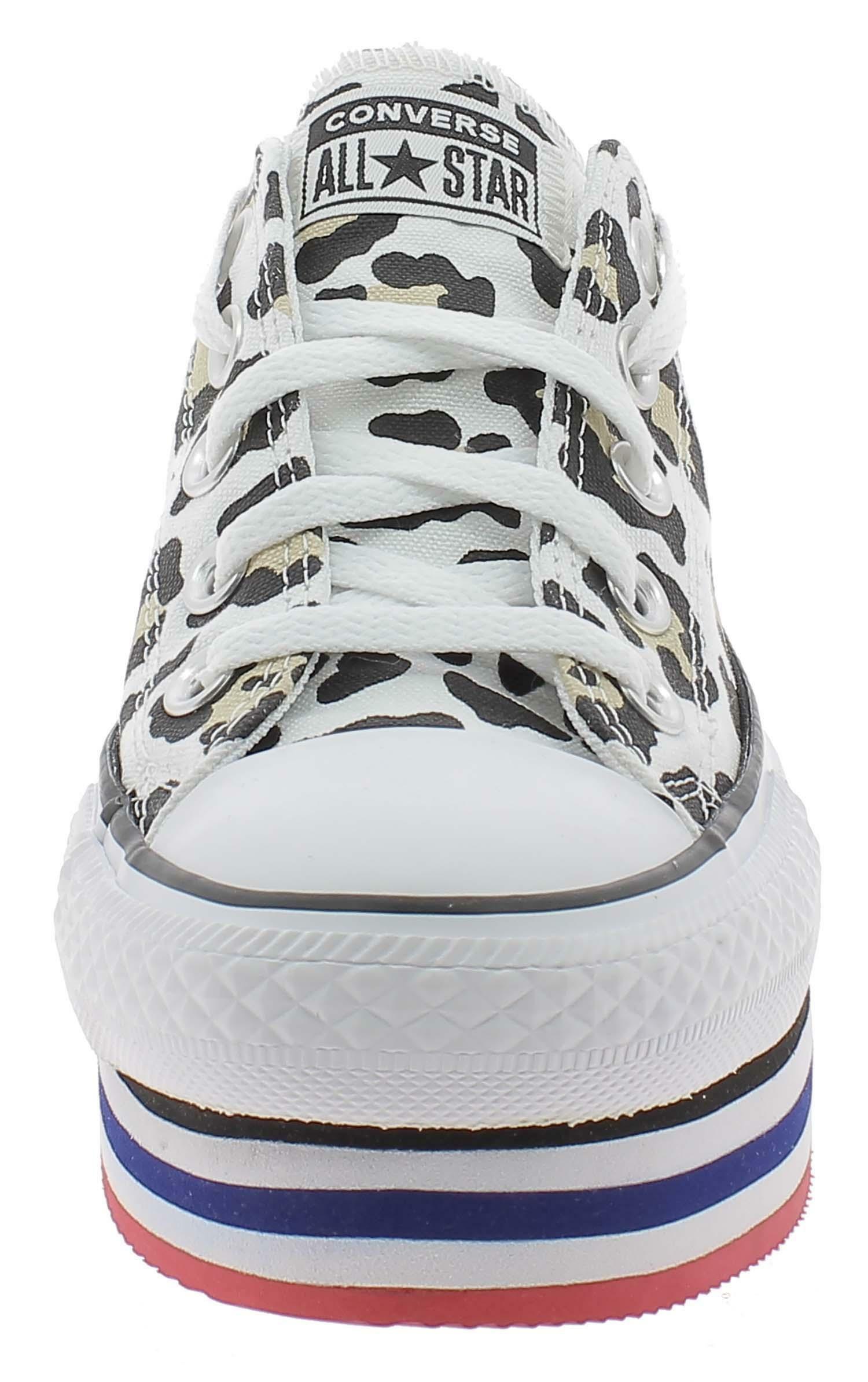 scarpe sportive maculate